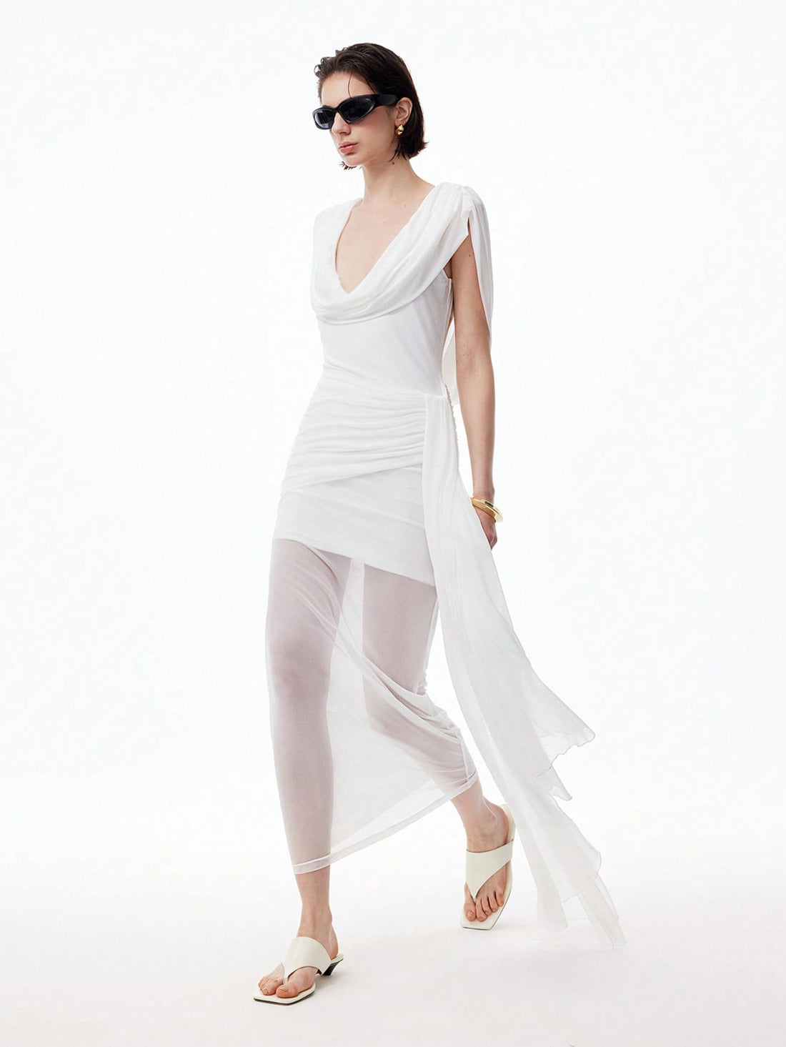 Step into summer with this playful sleeveless tulle mini dress, featuring charming ruched details and a flirty asymmetric hem. Perfect for date nights or graduation celebrations, it combines light, airy fabric with a fun silhouette to keep you comfortable and stylish all evening long. Embrace effortless elegance and turn heads wherever you go!