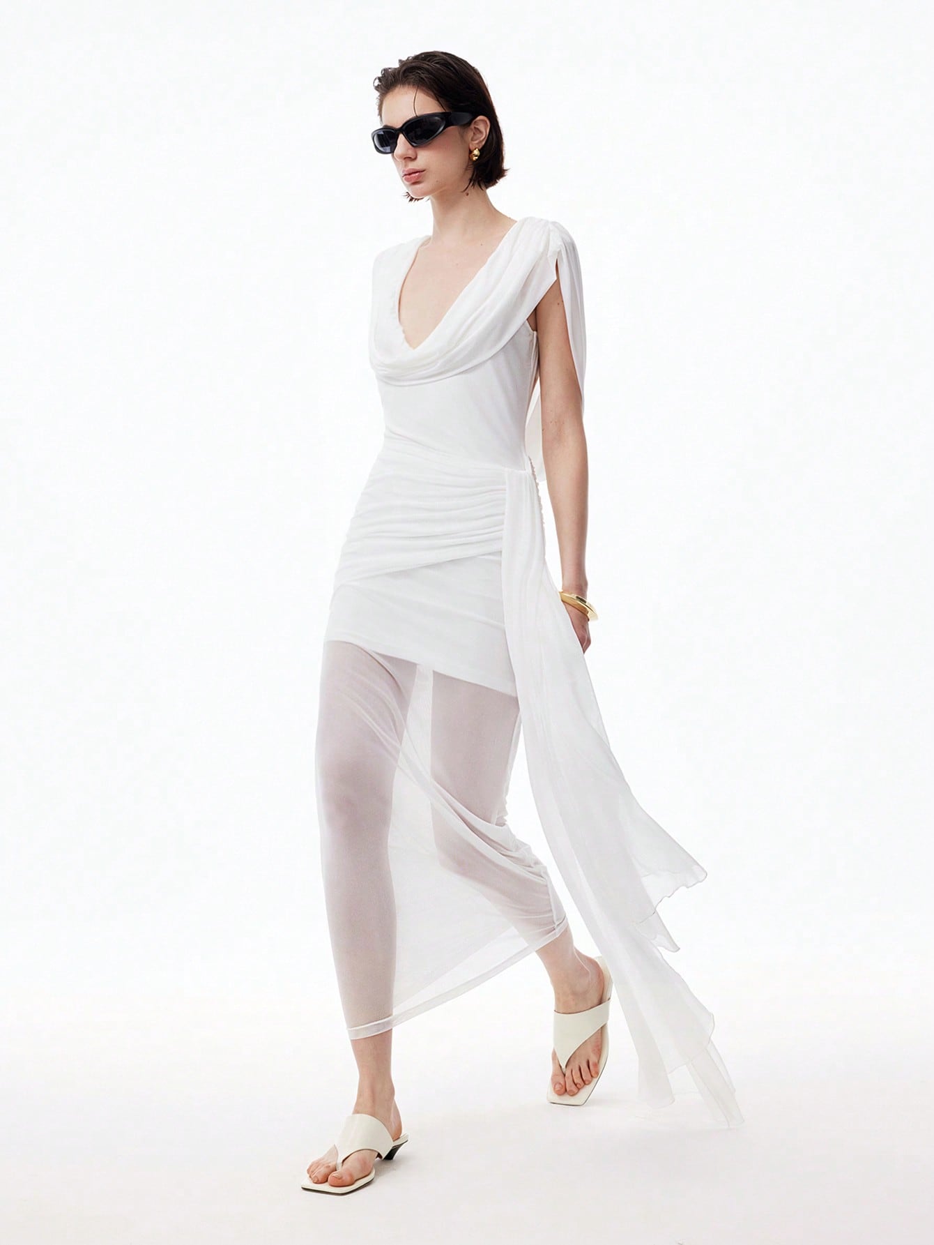 Step into summer with this playful sleeveless tulle mini dress, featuring charming ruched details and a flirty asymmetric hem. Perfect for date nights or graduation celebrations, it combines light, airy fabric with a fun silhouette to keep you comfortable and stylish all evening long. Embrace effortless elegance and turn heads wherever you go!