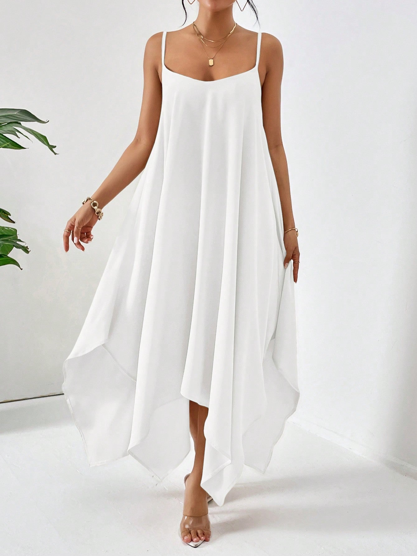 Slip into summer-ready style with this breezy solid color cami dress! Perfect for beach days, city strolls, or sunset dinners, this versatile piece effortlessly transitions from day to night. The flattering silhouette and comfortable fit make it a vacation must-have – just add sandals and your favorite accessories for an instantly chic look that says "out of office" in the most fashionable way!