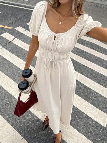 Step into summer with this playful and chic casual dress featuring puff sleeves and a trendy tie-front detail. Its solid color design makes it easy to mix and match, while the flattering silhouette keeps you comfortable and stylish all day long. Perfect for sunny days, brunch dates, or casual outings, this dress adds a fun, flirty touch to your warm-weather wardrobe.