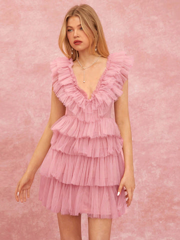 Effortlessly exude chic summer vibes with our backless ruffle mesh mini dress. With its playful design and elegant details, this dress is perfect for any occasion. Show off your style and confidence with this must-have piece for effortless elegance.