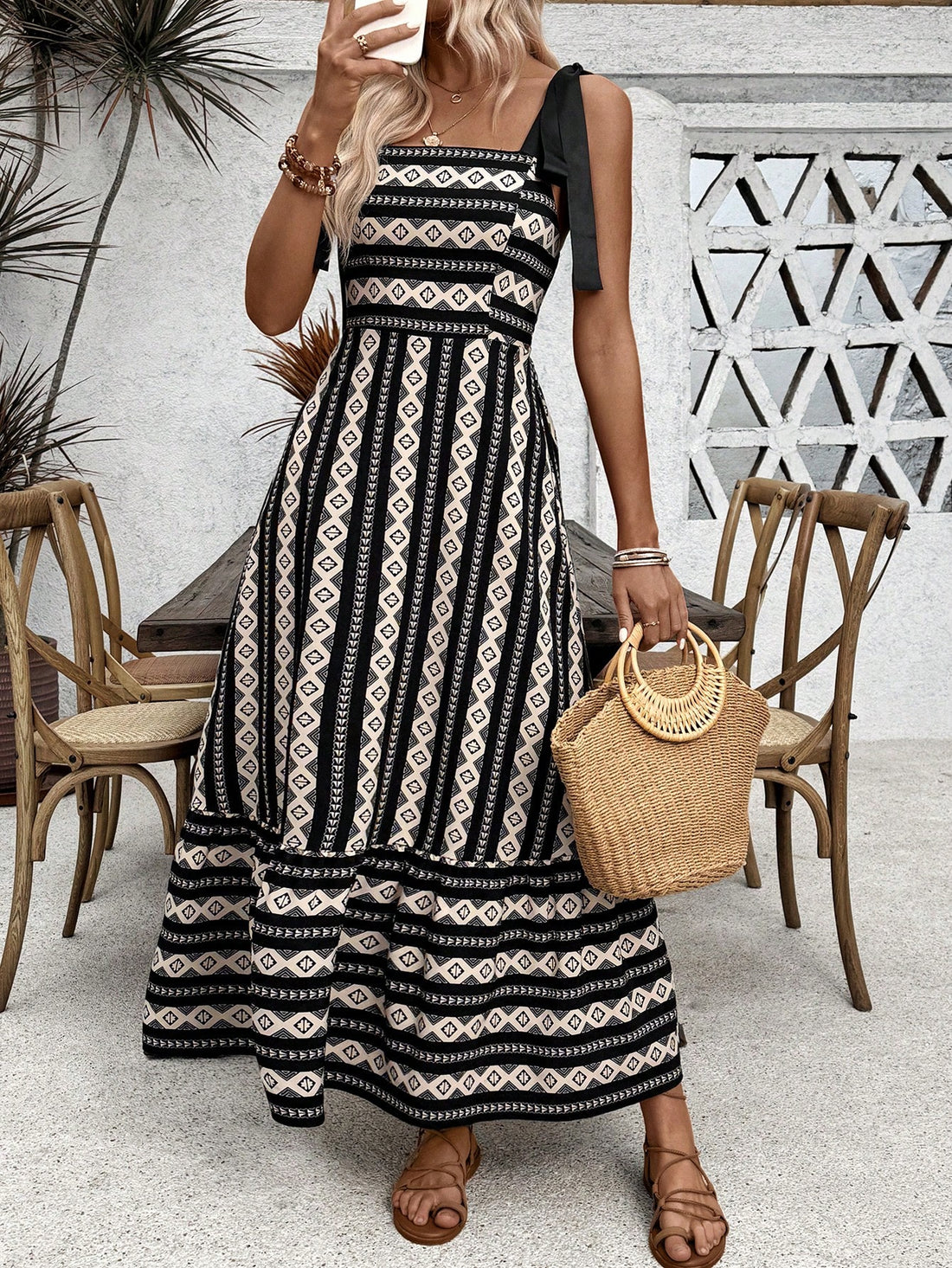Get ready to turn heads at the beach with our Chic Summer Vibes: Geometric Printed Maxi Dress! Its eye-catching design and flowy silhouette will keep you cool and stylish for all your beach getaways. Don't miss out on this must-have dress for the ultimate summer vibes!