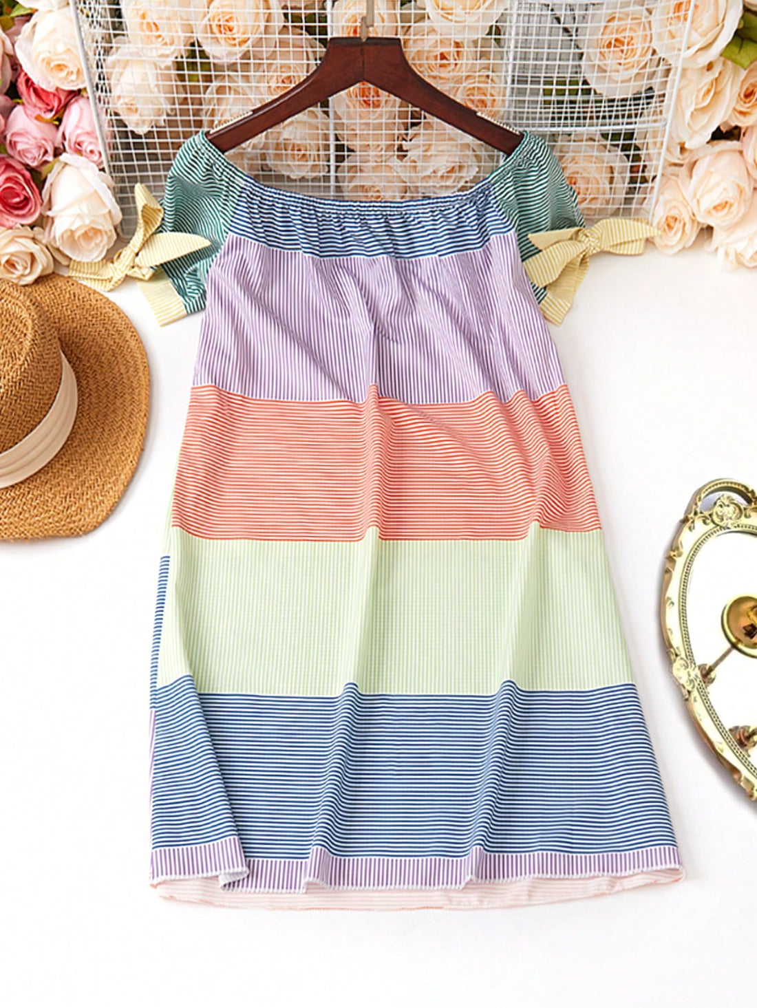 Get ready to rock your summer look with our Chic Summer Vibes midi dress! Featuring a trendy off-shoulder design and a playful tie hem, this dress is perfect for any occasion. The striped color block adds a touch of whimsy. Stay chic and stylish all summer long!