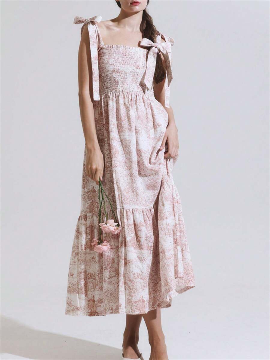 Introducing our Chic Summer Vintage Print A-Line Dress, featuring a flattering A-line silhouette and playful tie shoulder detailing. The smocked bust adds a touch of vintage charm to this versatile and stylish dress. Perfect for any summer occasion. (Get ready to turn heads!)