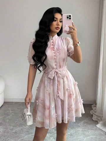 Elevate your vacation wardrobe with this chic tie-dye floral dress. Featuring a romantic stand collar, button-front closure, and flattering puff sleeves, this A-line silhouette offers effortless elegance. The high-waist design with belt detail creates a polished look, while the flared hem adds movement and grace. Crafted from 100% polyester woven fabric in a vibrant multicolor palette, it's perfect for getaways and special occasions. Regular fit, short length. Hand wash for easy care.
