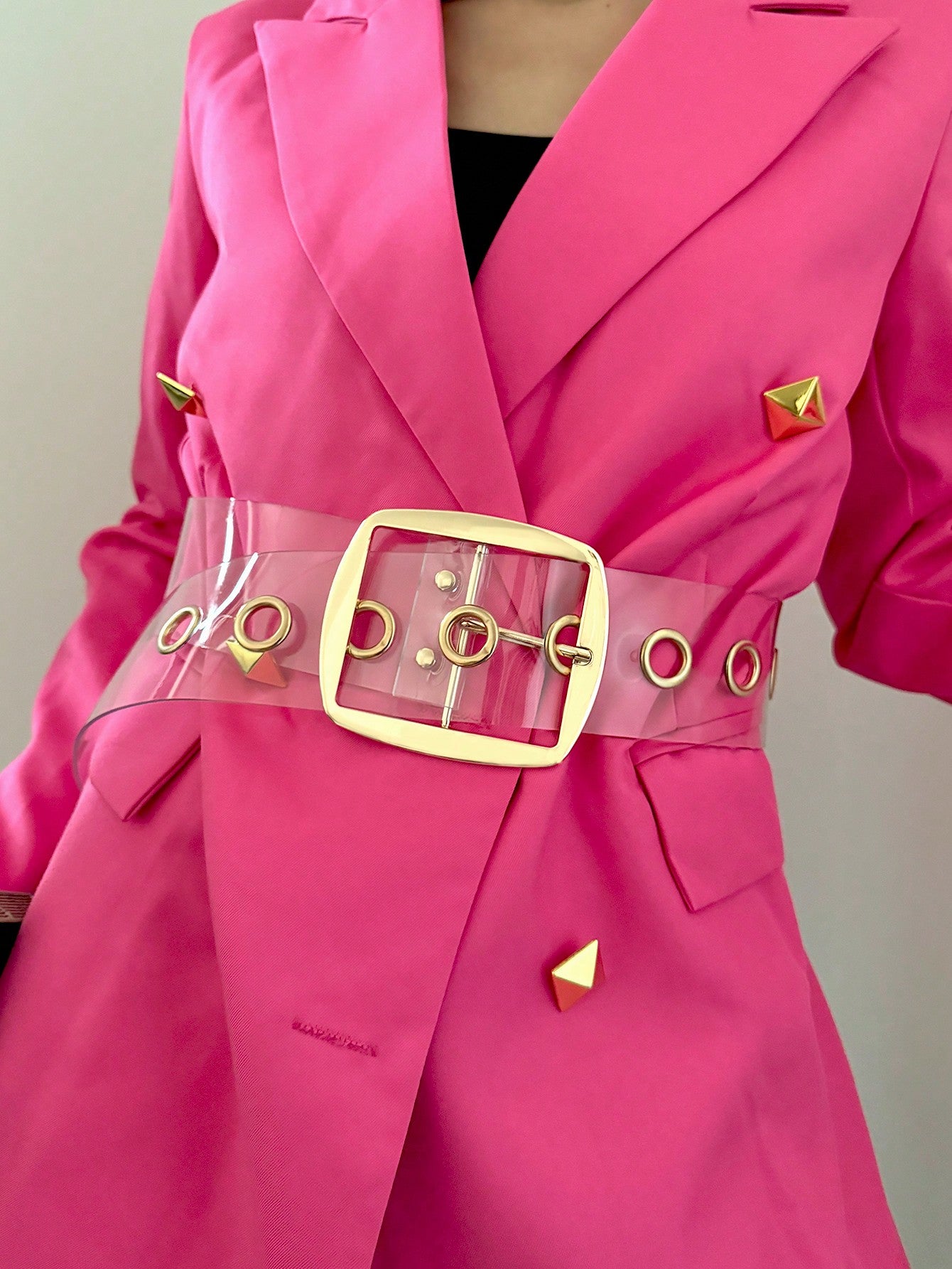 This chic transparent PVC wide belt is the perfect accessory for versatile styling options. It is ideal for completing your suit look, adding flair to dresses, or elevating your everyday wear. The transparent material adds a modern touch, making it a must-have for any fashion-forward individual.