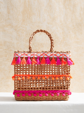 This stylish woven handbag is perfect for teens looking to make a statement. With its trendy design and chic wicker material, it's the perfect accessory for any outfit. Whether you're heading to school or out with friends, this handbag will elevate your look and show off your unique sense of style.