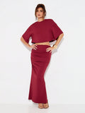 Make a statement this season with our stunning two-piece set that effortlessly transitions from holiday parties to evening soirées. The fitted crop top pairs perfectly with a flowing maxi skirt, creating a silhouette that's both sophisticated and fun. Whether you're dancing the night away or mingling at an upscale event, this ensemble delivers that coveted chic factor. The versatile design lets you mix and match with your favorite accessories, making it a wardrobe essential for anyone who loves looking fabu