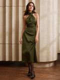 Elevate your style with this Green Pleated Halter Maxi Dress from Chic Urban Elegance. The halter neck adds a touch of elegance while the pleated design offers a flowy and flattering silhouette. Perfect for any urban setting, this dress will become your go-to for a chic and effortless look.