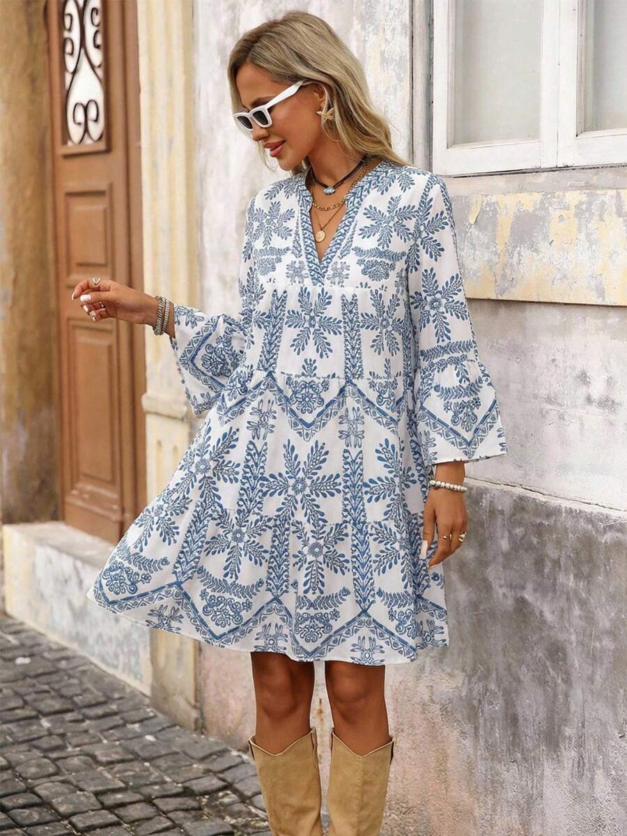 Elevate your seasonal wardrobe with this charming V-neck A-line dress, designed for effortless style. Featuring a playful ruffle hem, flare sleeves, and an all-over print in blue and white, this boho-inspired piece transitions seamlessly from country concerts to weekend getaways. The high-waist silhouette and three-quarter length sleeves offer a flattering, comfortable fit, while the woven fabric blend ensures durability. Perfect for those seeking relaxed elegance with a touch of whimsy.