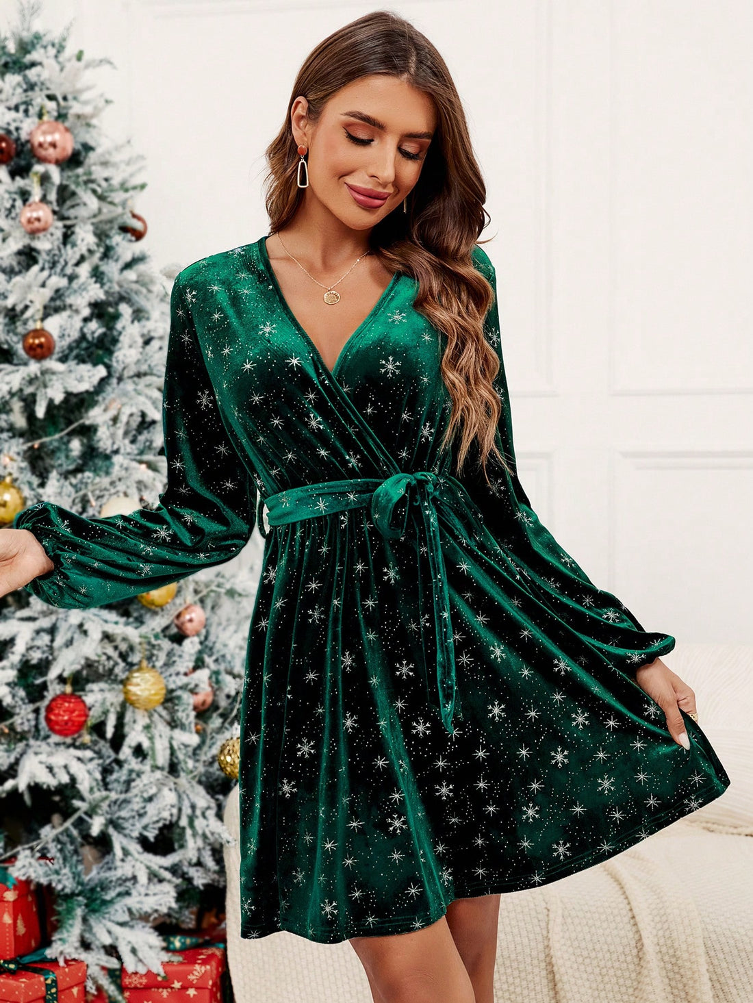 This elegant velvet dress features a unique snowflake print and statement lantern sleeves. Complete the look with the included belt for a chic and sophisticated ensemble. Stay stylish and warm this winter season.