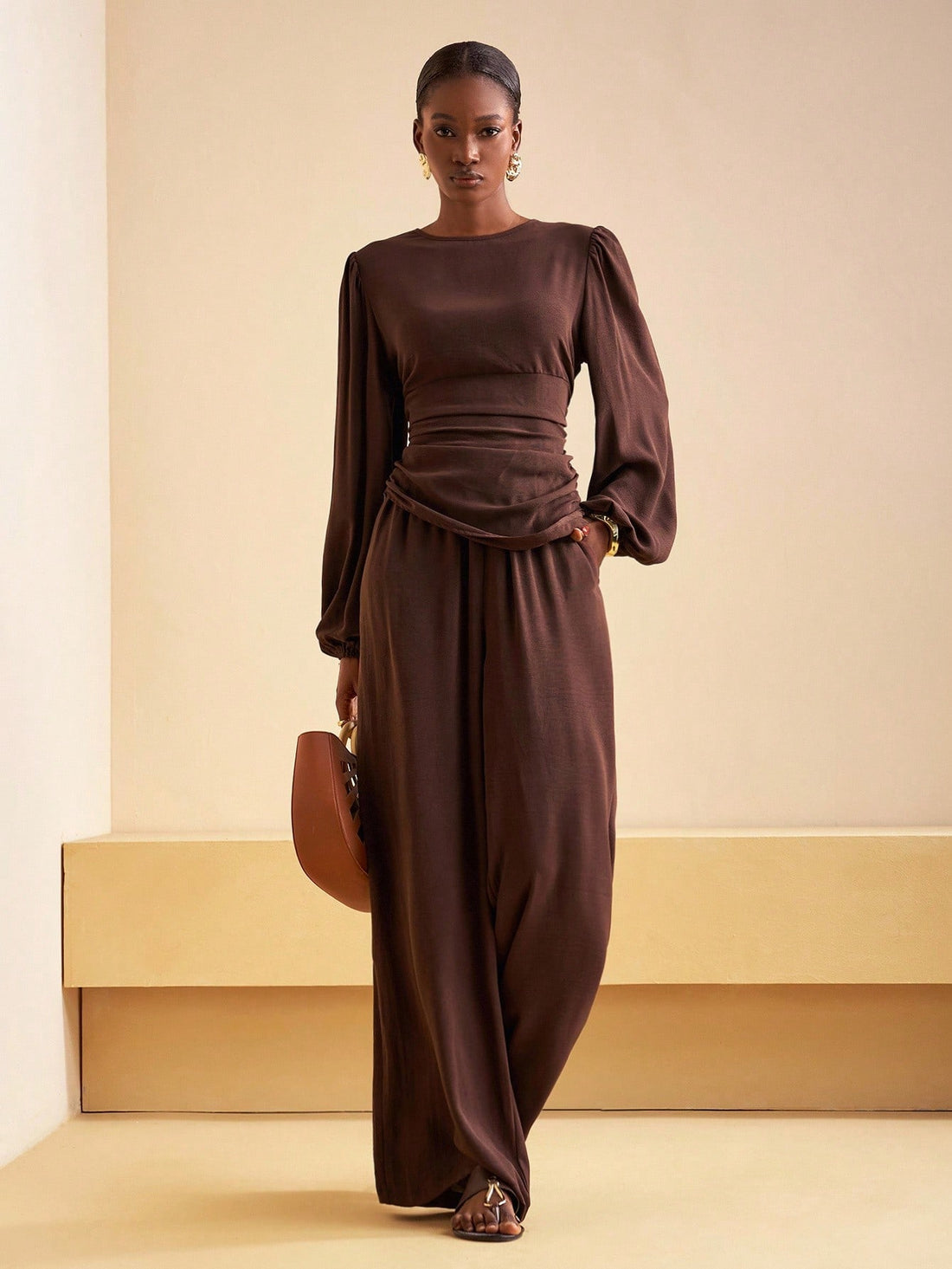 Elevate your wardrobe with this stunning 2-piece set that's basically a style cheat code! The asymmetric satin blouse drapes beautifully with modern flair, while the high-waist wide-leg pants create a flattering silhouette that works from office to dinner. The luxe satin finish catches the light just right, giving you that effortlessly polished look without trying too hard. Perfect for layering through fall and winter, this dynamic duo transitions seamlessly from day to night. Mix, match, and own every mome