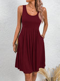 Stay stylish and comfortable in our Chic & Versatile Solid Color Dress with Pockets. Perfect for any occasion, this sleeveless dress features convenient pockets and a timeless solid color design. A must-have addition to your wardrobe!