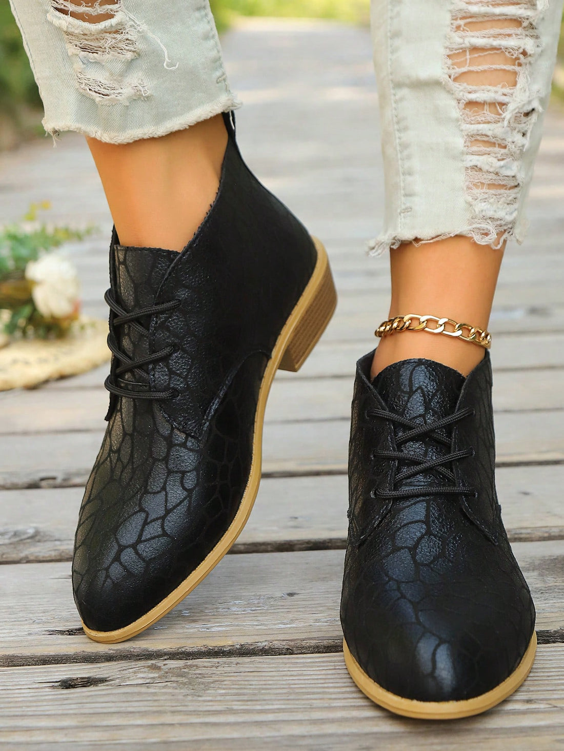 These Chic & Versatile Black Low Heel Lace-Up Boots are the perfect addition to your wardrobe. With a sleek and stylish design, these boots are ideal for both work and autumn-winter style. The low heel provides comfort and the lace-up feature adds a touch of sophistication. Elevate your look with these must-have boots.