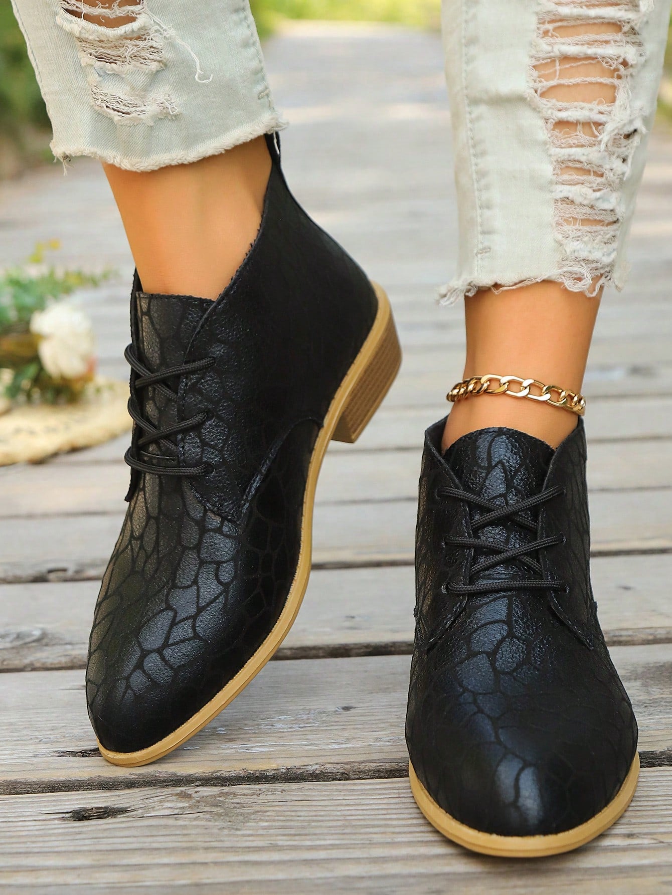These Chic & Versatile Black Low Heel Lace-Up Boots are the perfect addition to your wardrobe. With a sleek and stylish design, these boots are ideal for both work and autumn-winter style. The low heel provides comfort and the lace-up feature adds a touch of sophistication. Elevate your look with these must-have boots.