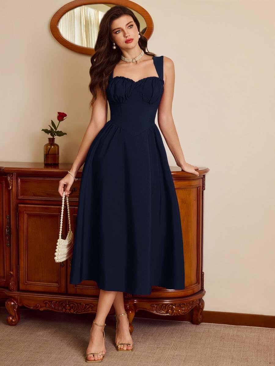 Full front view of navy ruched sweetheart fit-and-flare midi dress with wide straps