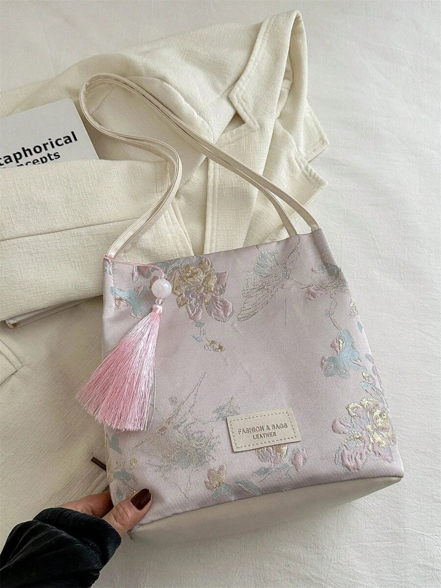 Effortless style meets everyday practicality with this chic vintage canvas crossbody bag. Crafted from durable 100% polyester canvas, this medium-sized bucket bag features a striking tie-dye pattern in soft pink tones that adds a retro flair to any outfit. Perfect for shopping trips and casual outings, the bag combines minimalist design with functional details. 