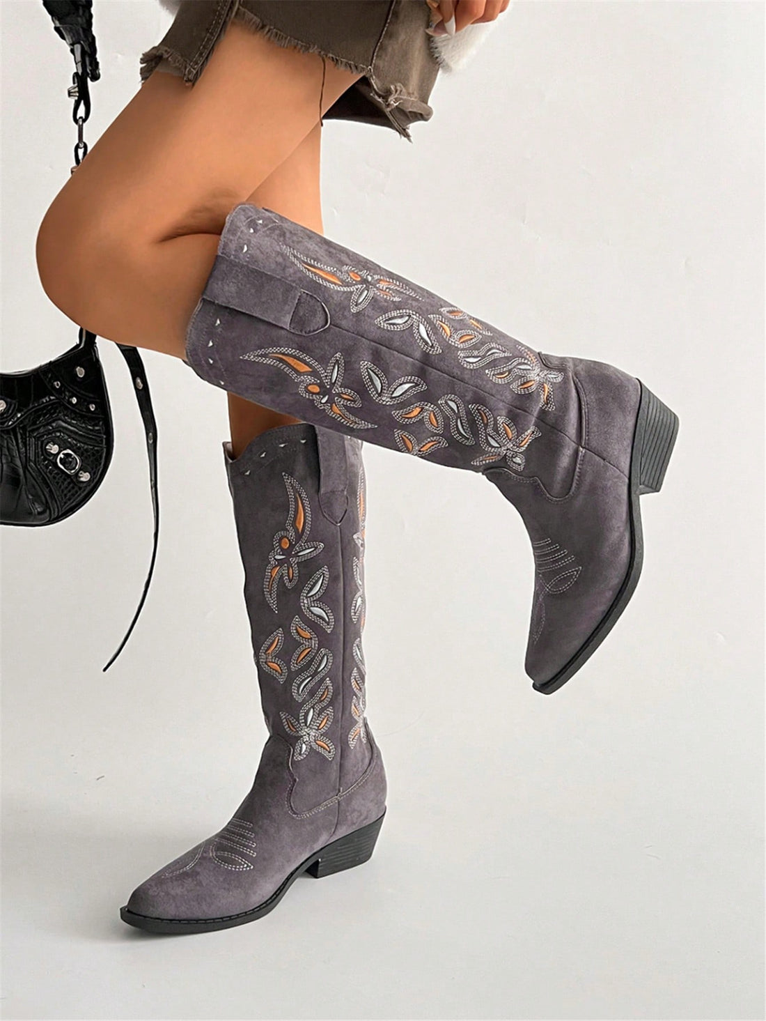 Step into effortless style with our Chic Vintage Embroidered Western Block Heel Boots. Featuring intricate embroidery and a sturdy block heel, these boots exude vintage charm while providing all-day comfort. Perfect for adding a touch of Western flair to any outfit.