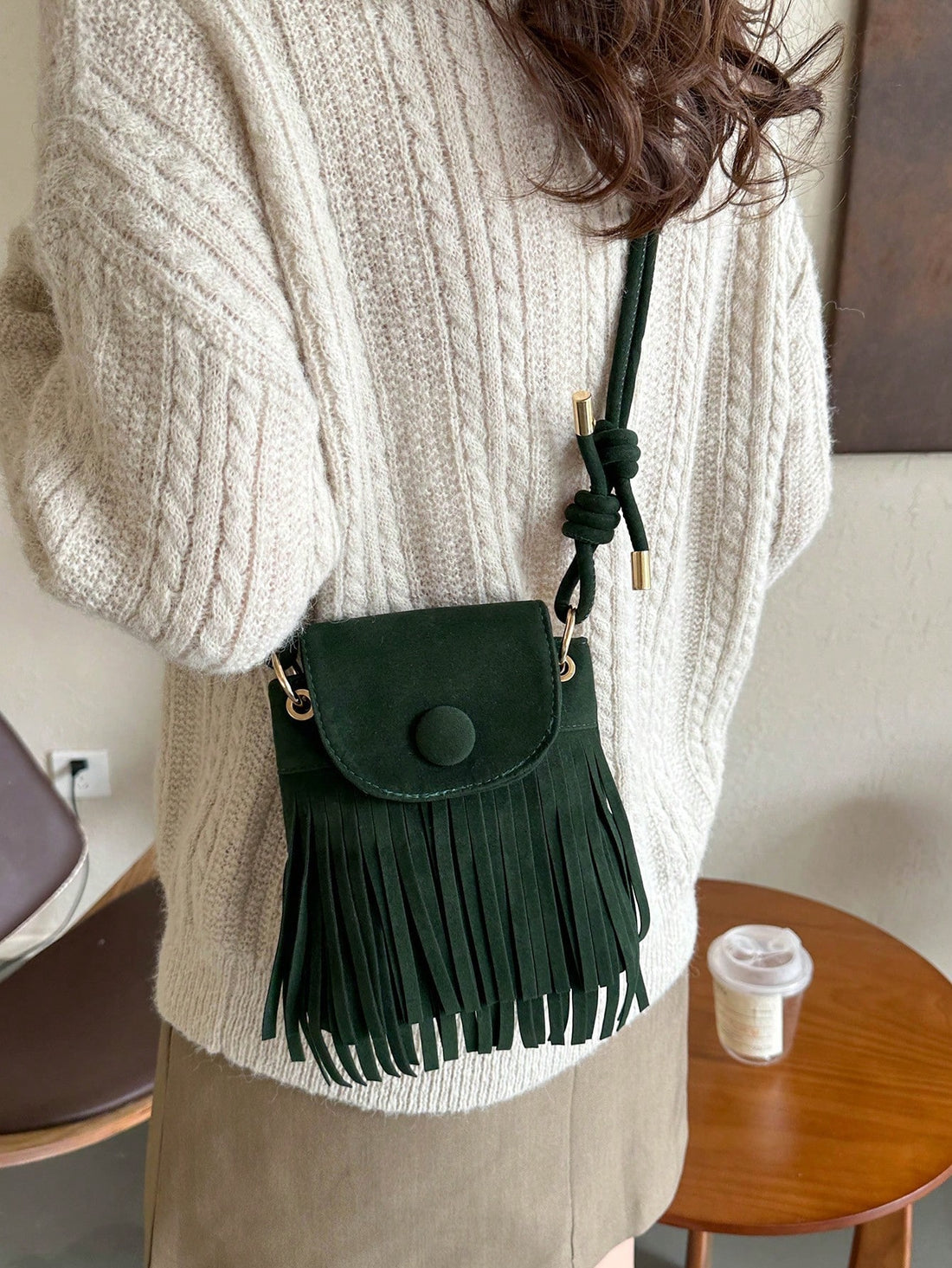 Unleash your inner fashionista with our chic vintage faux suede tassel shoulder bag – the ultimate stylish port-inspired accessory. Made with high-quality materials and featuring trendy tassels, this bag is the perfect statement piece for any outfit. Elevate your style game and stand out from the crowd with this must-have bag.