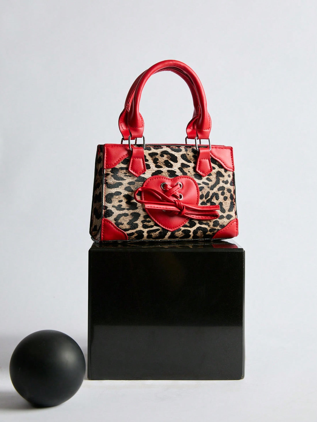 Add a pop of wild charm to any outfit with this Chic Vintage Mini Leopard Print Bow Handbag. Its playful bow detail and compact size make it ideal for shopping sprees, lively parties, or everyday adventures. Carry your essentials in style while turning heads wherever you go!