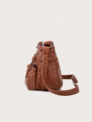 Add a dash of vintage charm to your everyday look with this Chic Vintage PU Leather Shoulder Bag. Perfectly sized for all your essentials, it switches effortlessly between messenger and crossbody styles to match your mood. Soft yet durable PU leather ensures comfort and long-lasting wear, making it your new go-to companion for city strolls or weekend adventures. Carry a little nostalgia with a modern twist!