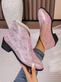 Add a pop of color to your shoe collection with these chic vintage pink ankle boots. The back zipper makes them easy to slip on and off, perfect for the stylish woman on the go. With a 5cm heel, these boots are both trendy and comfortable for the autumn and winter seasons.