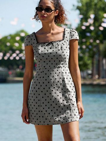 Step into autumn with effortless charm in this delightful polka dot mini dress. The square neckline and voluminous puff sleeves deliver vintage-inspired elegance with a modern twist, perfect for weekend outings and seasonal adventures. Crisp white dots dance across the fabric, creating a timeless pattern that pairs beautifully with boots, sneakers, or ballet flats. Whether you're exploring a farmers market or catching golden hour at your favorite café, this dress brings playful sophistication to every momen