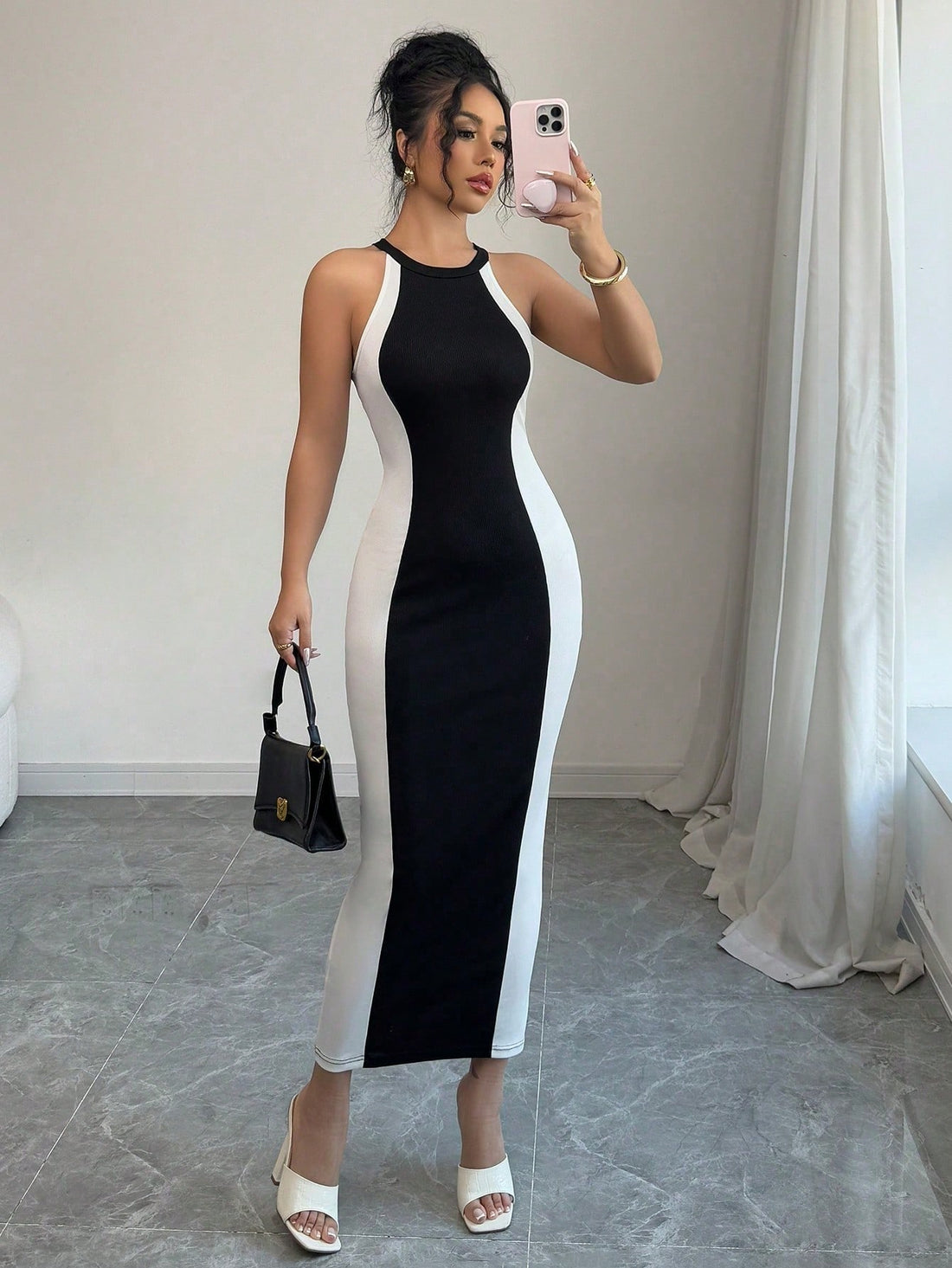 Get ready to make a statement with our Chic Vintage Splicing Dress! In classic black and white color block, this sleeveless dress is perfect for spring and summer. With its unique design, you'll be sure to turn heads wherever you go. Embrace your quirky side and add some fun to your wardrobe!