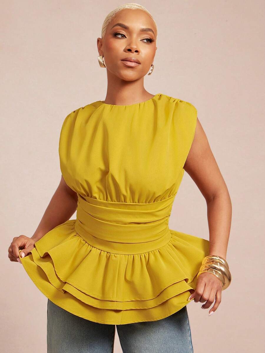 Discover effortless sophistication with the Chic Vixey Peplum Top in vibrant yellow. This woven masterpiece combines contemporary design with timeless appeal, featuring intricately ruched sleeves and a layered flared hem that creates beautiful movement. The slim fit hugs your frame while the peplum silhouette adds curves and dimension. Designed with a classic round neckline and sleeveless construction, it's ideal for warm-weather styling and festive celebrations.&nbsp;