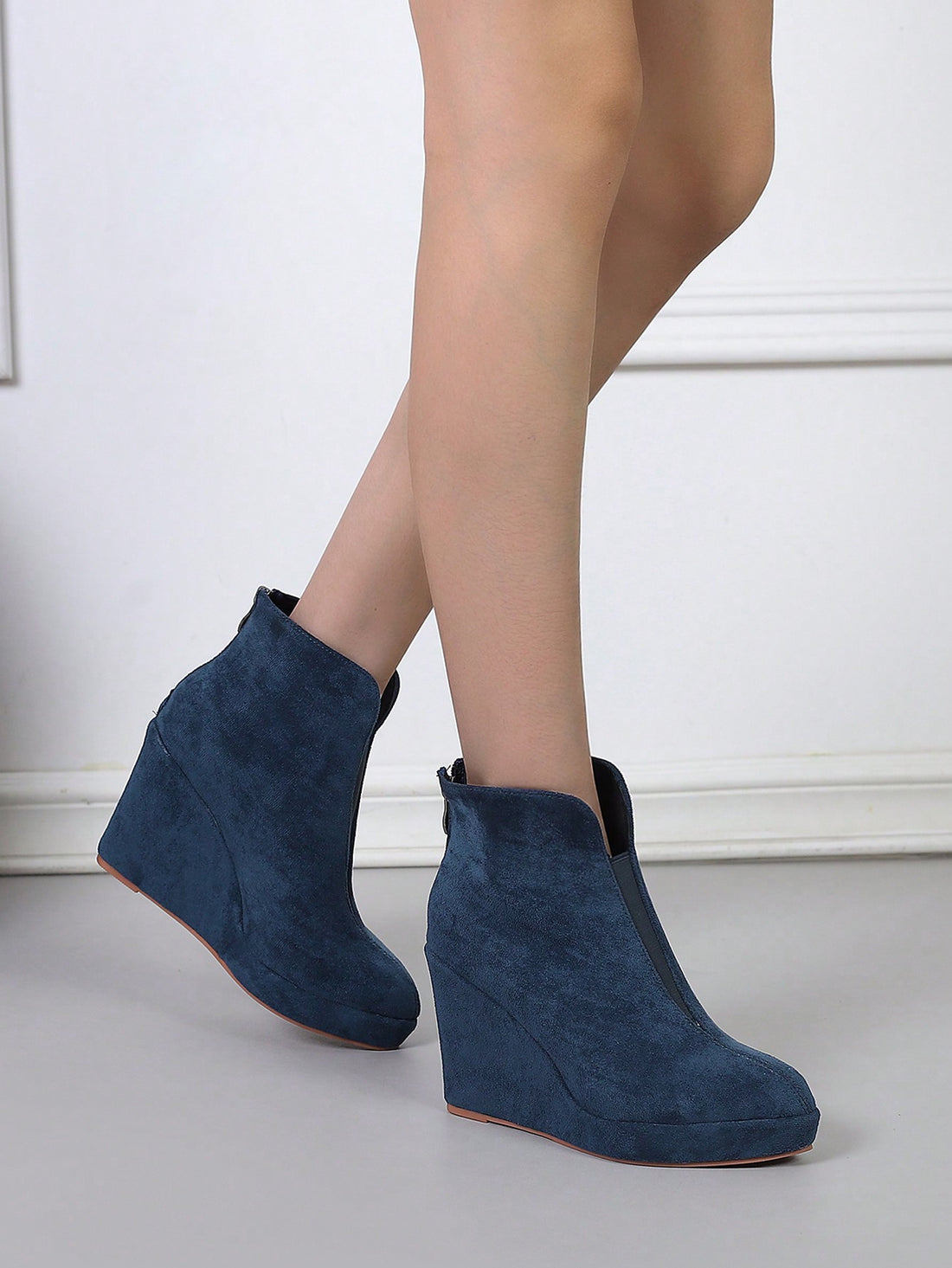 Elevate your style effortlessly with our Chic Wedge Platform High Heel Ankle Boots. These versatile boots add both height and comfort, making them the perfect choice for any occasion. Make a statement and stand out from the crowd with these stylish and comfortable boots.