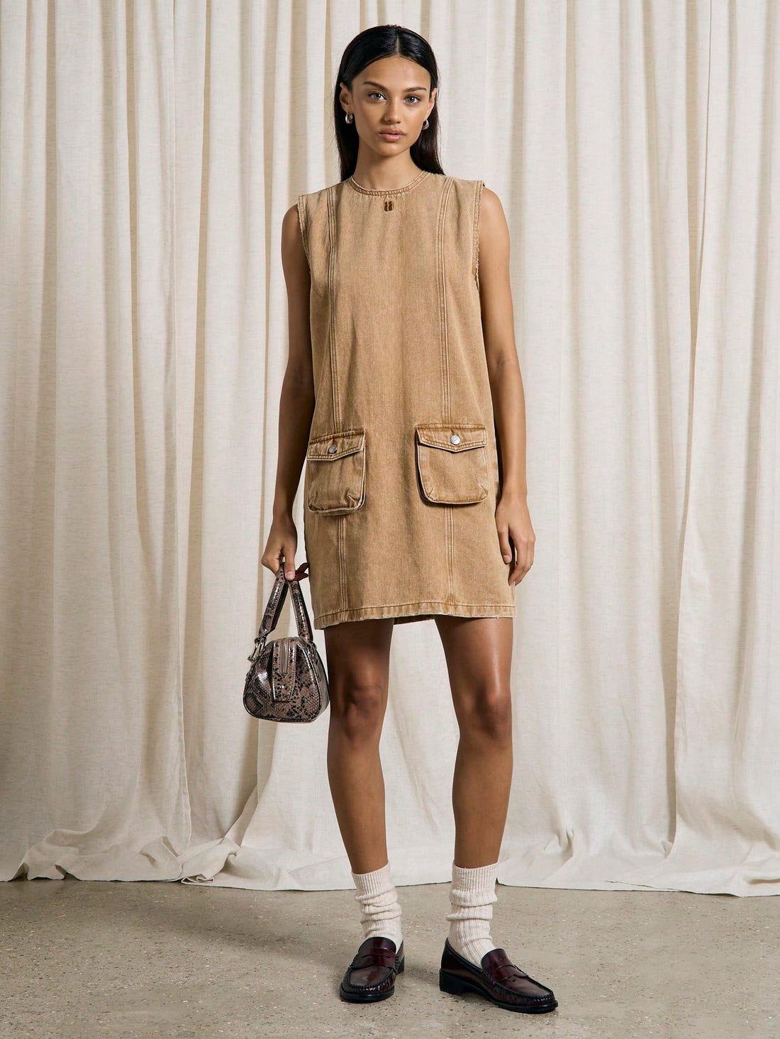 Step into effortless cool with this Chic Western Washed Denim Cargo Penny Dress. Featuring handy pocket details and a relaxed fit, it’s perfect for adding a playful, laid-back vibe to your wardrobe. Whether you’re out exploring or meeting friends, this dress combines comfort and style with a touch of Western charm.