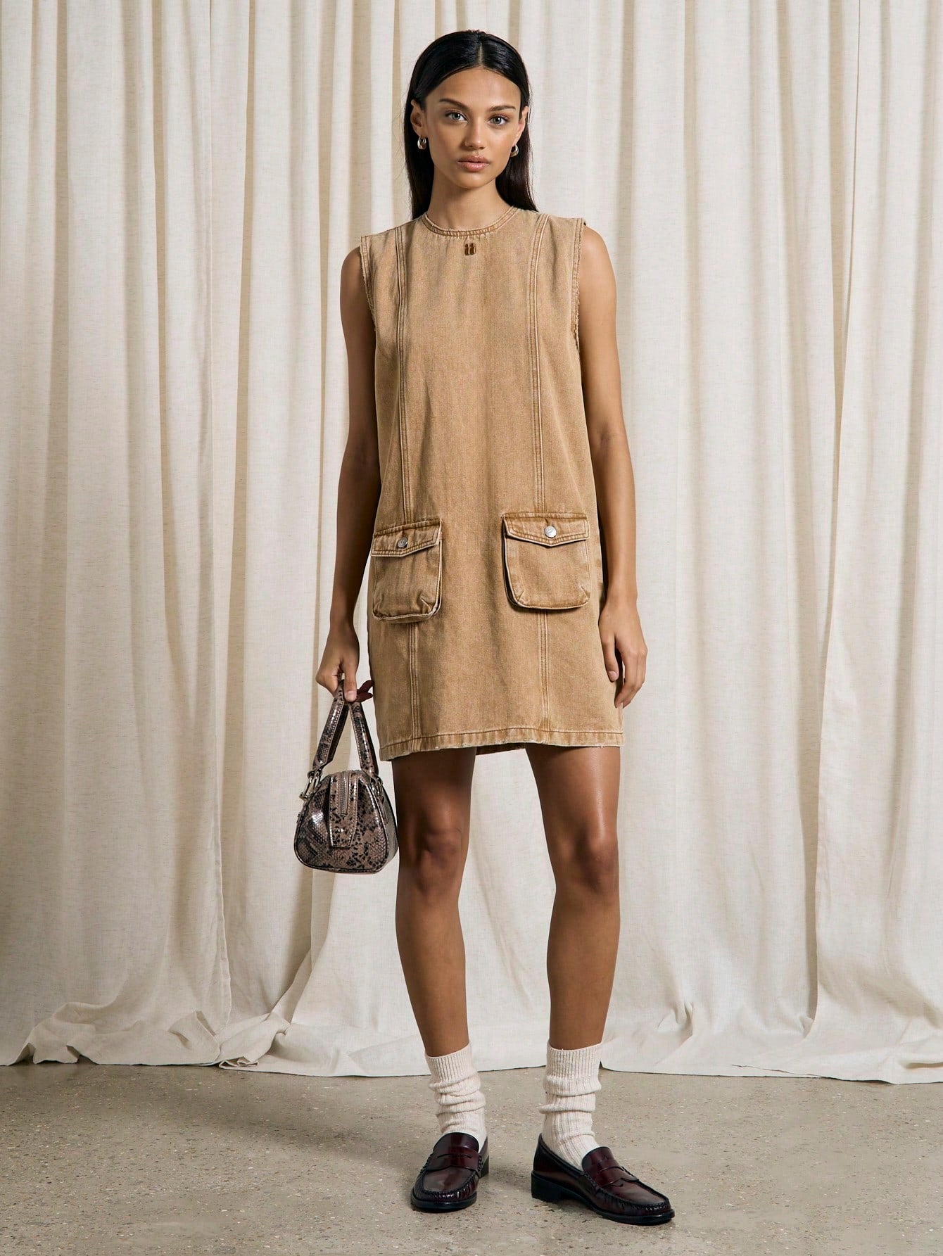 Step into effortless cool with this Chic Western Washed Denim Cargo Penny Dress. Featuring handy pocket details and a relaxed fit, it’s perfect for adding a playful, laid-back vibe to your wardrobe. Whether you’re out exploring or meeting friends, this dress combines comfort and style with a touch of Western charm.