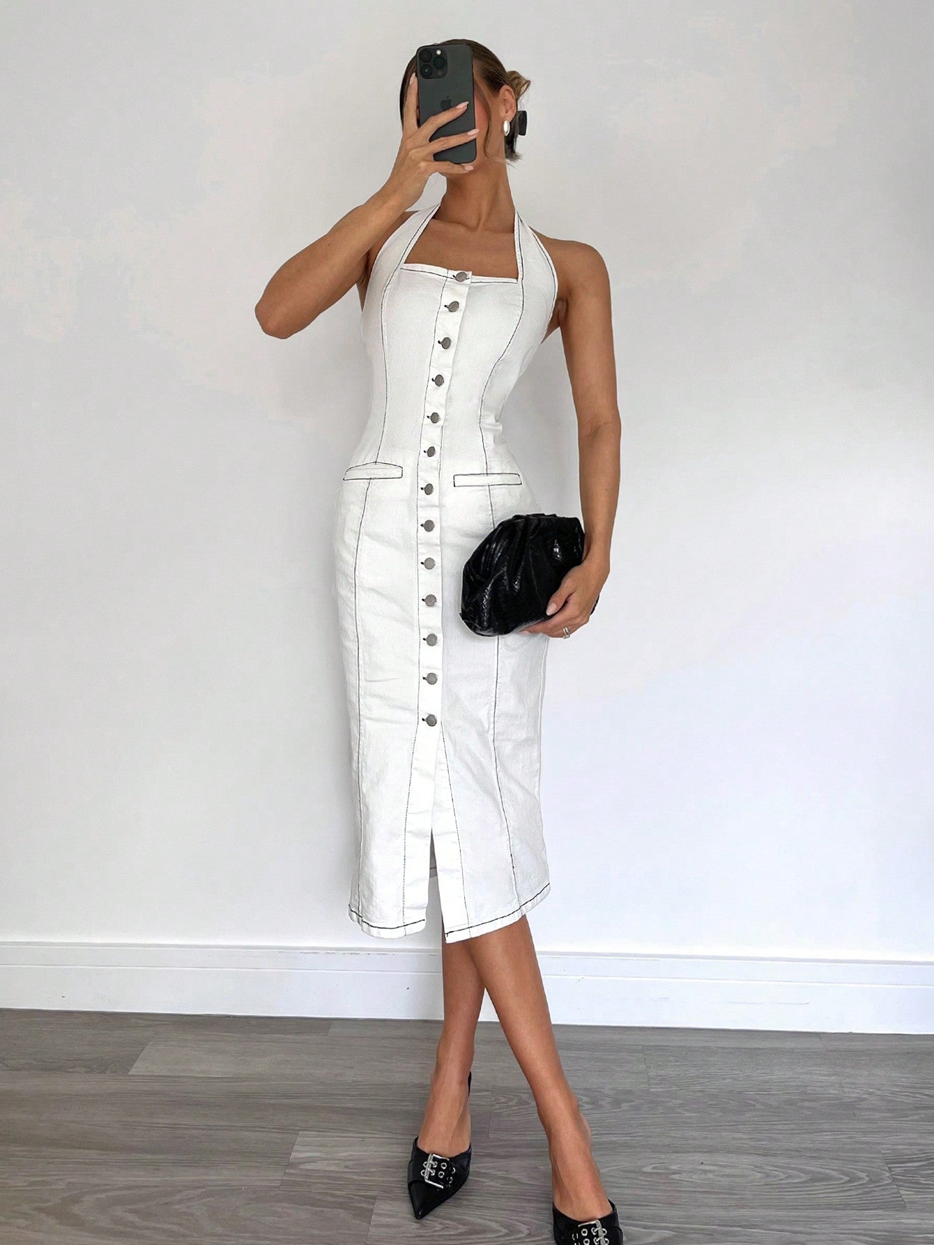 This dress is sure to tie up your look with its chic white denim material and sleeveless design. Show off your carefree style with the tie-up feature that's perfect for a fun day out. Get ready to rock this dress effortlessly!