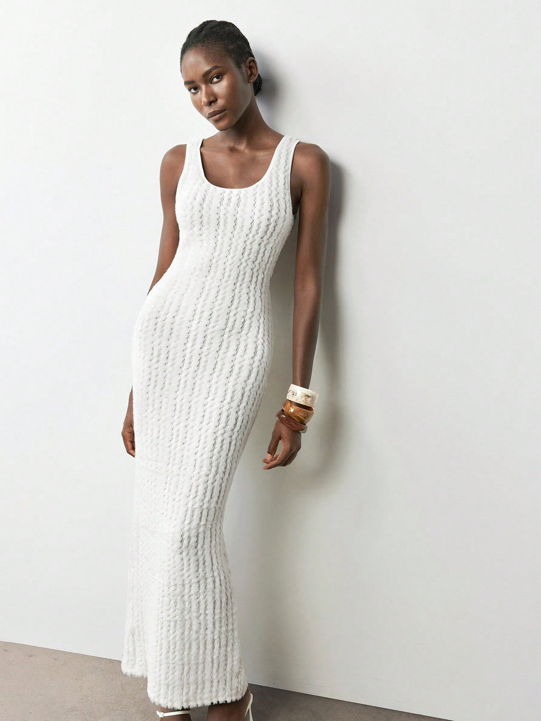 Step out in style with this Chic White Sleeveless Dress featuring a daring slit. Its sleek design perfectly blends elegance and fun, making it your go-to for graduation day or ringing in the New Year. Feel confident and festive while turning heads wherever you go!