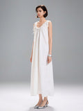 Step out in style with this Chic White Sleeveless Ruffle Hem Midi Dress, designed to bring casual elegance to your wardrobe. Its breezy sleeveless cut keeps you cool, while the playful ruffle hem adds a flirty twist to your look. Perfect for sunny days or relaxed evenings, this dress effortlessly combines comfort and charm for any occasion.