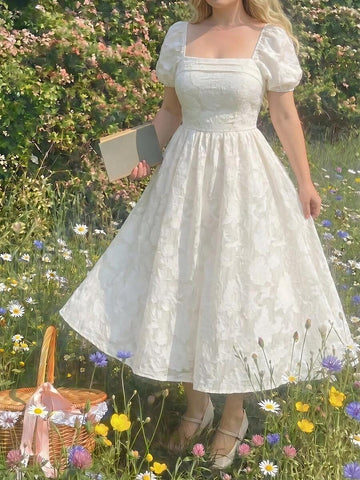 Chic white summer party dress with a square neckline and puffed petal sleeves. Perfect for brunches, garden parties, vacations, and special events.