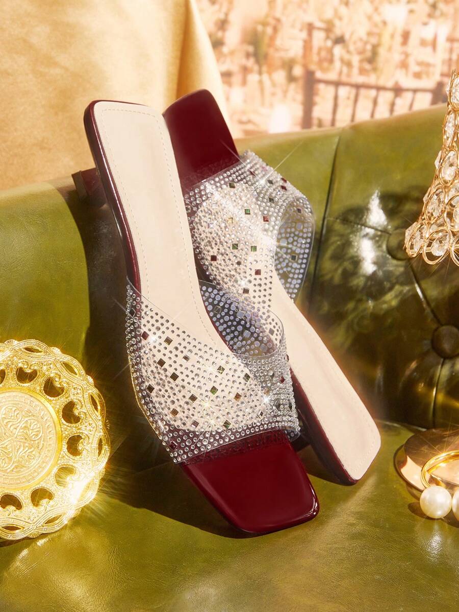 Step out in style with these chic wine red slides, designed to add a pop of glam to any outfit. Featuring sparkling rhinestone accents and a trendy square toe, they blend comfort with a playful edge. Perfect for turning heads while keeping your feet happy all day long!