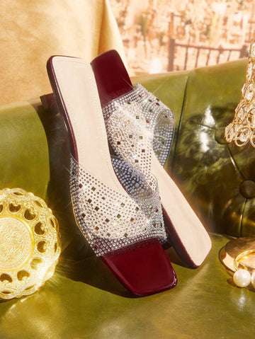 Step out in style with these chic wine red slides, designed to add a pop of glam to any outfit. Featuring sparkling rhinestone accents and a trendy square toe, they blend comfort with a playful edge. Perfect for turning heads while keeping your feet happy all day long!