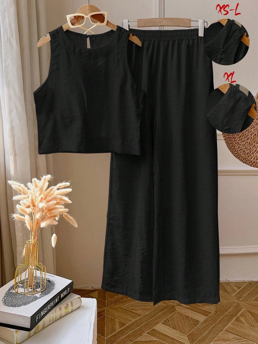 Elevate your everyday look with this fabulous two-piece set that's basically a style shortcut! The sleek sleeveless top pairs perfectly with matching leggings in a clean, solid color that goes with everything in your closet. Whether you're running errands, hitting the gym, or lounging at home, this effortless combo keeps you looking put-together without the fuss. Comfortable, versatile, and undeniably chic—because who says looking good has to be complicated?
