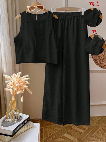 Elevate your everyday look with this fabulous two-piece set that's basically a style shortcut! The sleek sleeveless top pairs perfectly with matching leggings in a clean, solid color that goes with everything in your closet. Whether you're running errands, hitting the gym, or lounging at home, this effortless combo keeps you looking put-together without the fuss. Comfortable, versatile, and undeniably chic—because who says looking good has to be complicated?