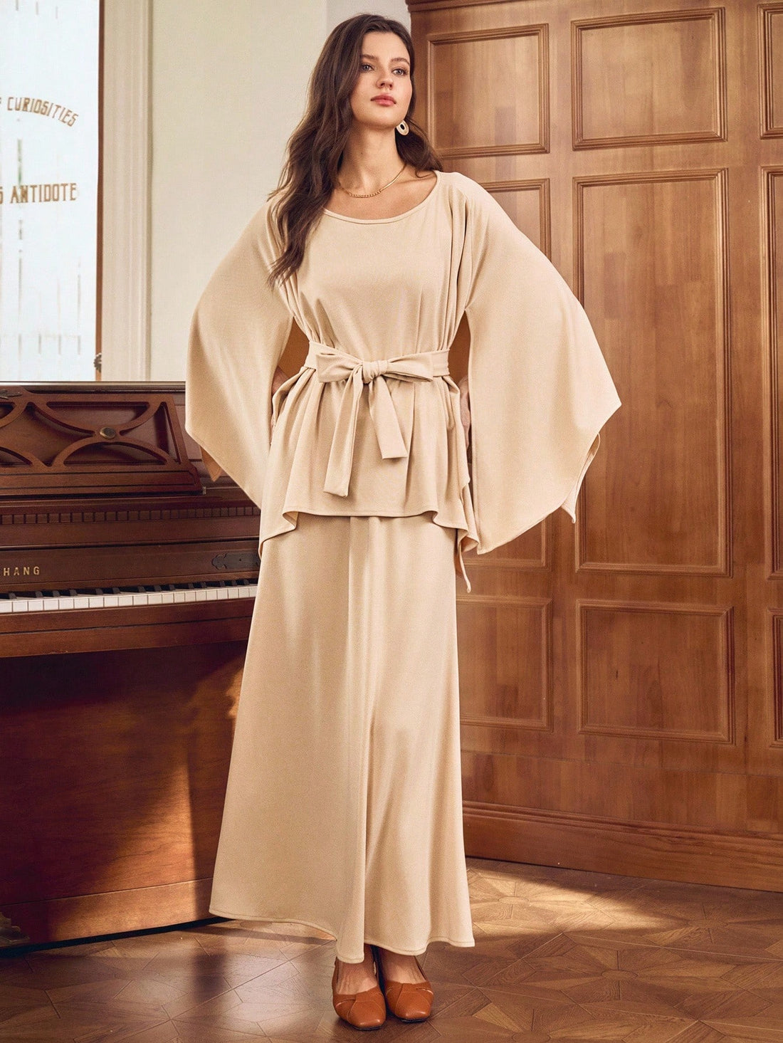 Unleash your inner fashionista with our Chic Women's Asymmetrical 2-Piece Poncho Set! This set features trendy flare sleeves and a stylish round neck, perfect for any occasion. Stay stylish and comfortable with this unique and versatile ensemble. (No need to sacrifice style for comfort here!)