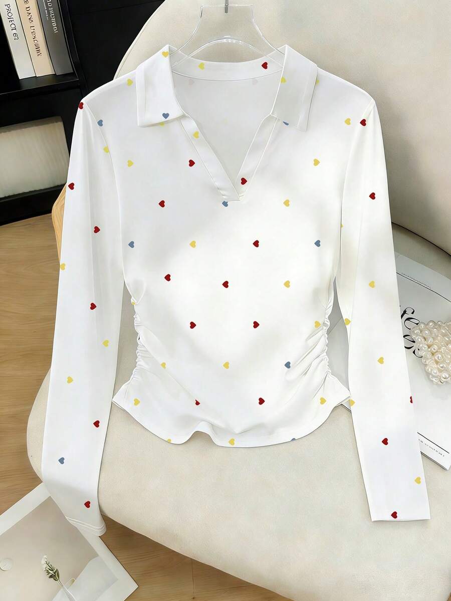 Elevate your autumn wardrobe with this chic women's long sleeve polo t-shirt, featuring a sophisticated black cherry print design. The classic polo silhouette offers timeless style with modern appeal, perfect for casual outings, weekend gatherings, or layering through cooler months. Crafted for comfort and versatility, this piece transitions effortlessly from day to night. An ideal gift for the woman who appreciates understated elegance and quality basics.