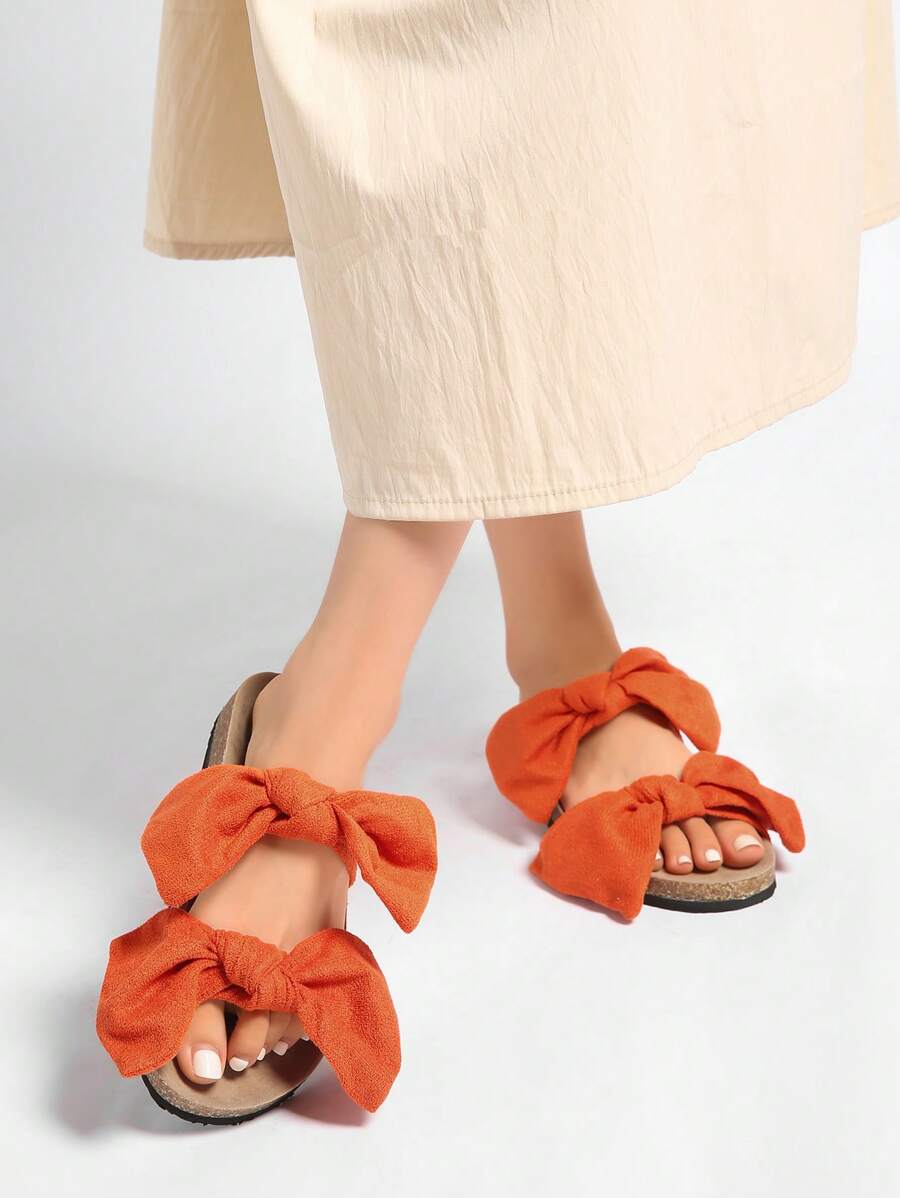 Step into summer with these Chic Women's Bowknot Flat Sandals! Designed for comfort and style, their playful bowknot detail adds a fun twist to your casual look. Perfect for sunny days, these flats keep your feet happy while turning heads wherever you go. Easy to slip on and light to wear, they’re your new go-to for effortless summer vibes.