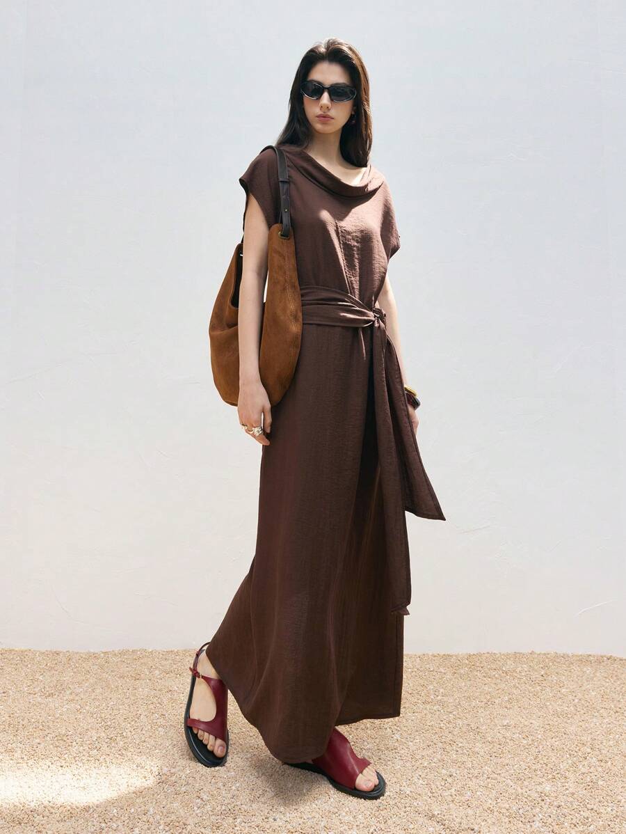 Step into effortless charm with this chic brown long dress designed for playful country vibes. Featuring flutter sleeves that dance with every move and a tie waist that flatters your silhouette, it’s perfect for casual days when you want to feel both comfy and stylish. Whether you’re wandering through fields or sipping lemonade on the porch, this dress brings a touch of whimsy to your wardrobe.