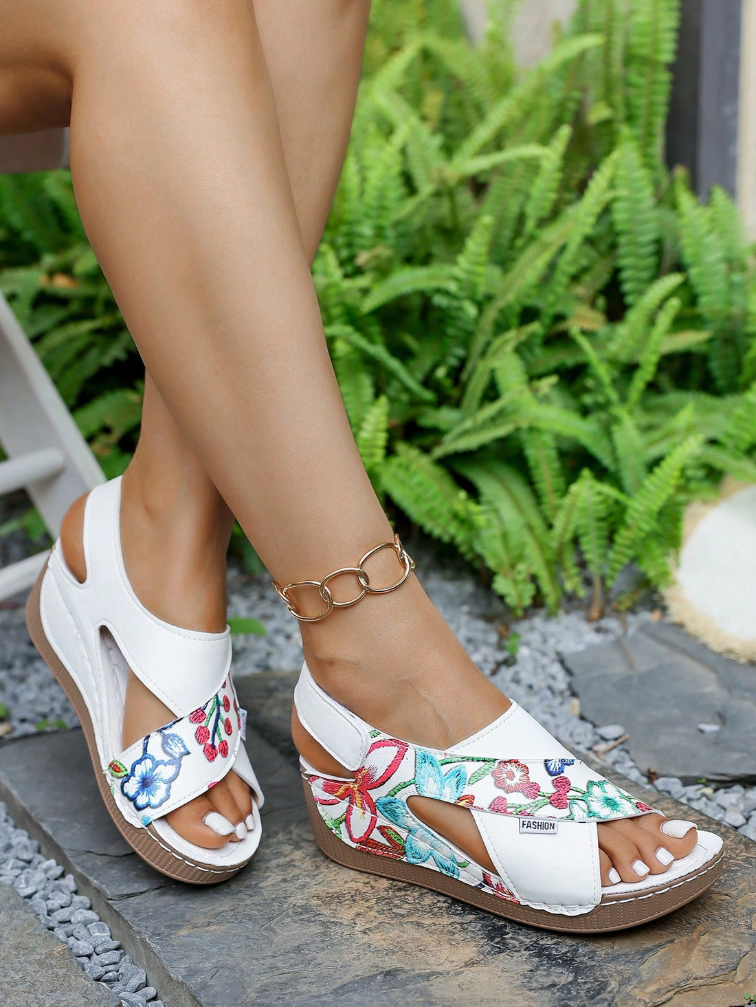 Elevate your style (and your height!) with these chic wedge sandals. The thick sole adds a boost to your stature while the convenient hook-and-loop closure makes slipping in and out a breeze. Perfect for casual outings when you want comfort without sacrificing fashion-forward flair. Strut your stuff with confidence in these playful yet practical summer essentials!