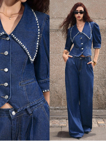 Elevate your denim game with this fabulous blouse set that's equal parts sass and sophistication! Featuring statement puff sleeves that demand attention and shimmering rhinestone accents that catch the light just right, this piece transforms your everyday look into something truly special. The classic denim construction keeps things timeless while the playful details add that modern edge you've been craving. Perfect for dressing up a casual outfit or bringing some sparkle to your weekend plans. Style it sol
