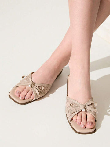 Elevate your summer wardrobe with these sophisticated flat sandals, featuring delicate dot mesh detailing and an elegant bow knot accent adorned with pearl embellishments. The square toe design and comfortable flat heel make them perfect for both office settings and special occasions. Crafted with a breathable lace upper, durable TPR outsole, and cushioned PU leather insole, these slides offer all-day comfort without compromising on style. The apricot hue adds a warm, versatile touch to any ensemble, making