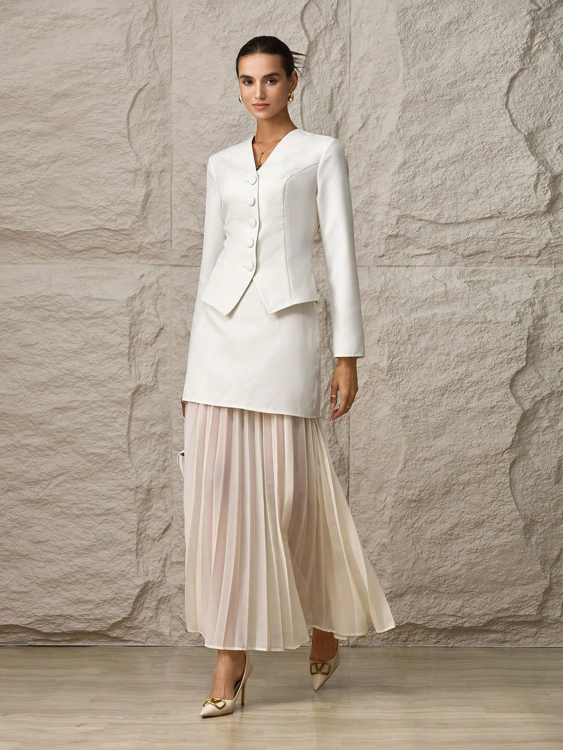 Elevate your wardrobe with this fabulous two-piece ensemble that's ready for anything! The crisp single-breasted jacket brings polished sophistication, while the gracefully pleated skirt adds movement and charm. Perfect for office meetings, weekend brunches, or that special occasion when you want to feel absolutely stunning. Mix, match, or wear together—this dynamic duo gives you endless styling possibilities. Timeless elegance meets modern flair in one irresistible set.