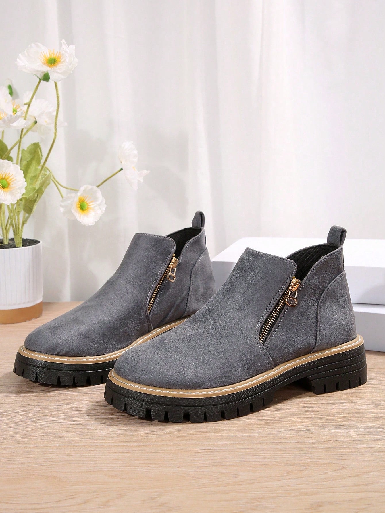 Add some flair to your wardrobe with these Chic Women's Flat Ankle Boots! The stylish zipper detail adds a touch of edge to any outfit. Perfect for any occasion, these boots are both comfortable and fashionable. Grab a pair today and step out in style!