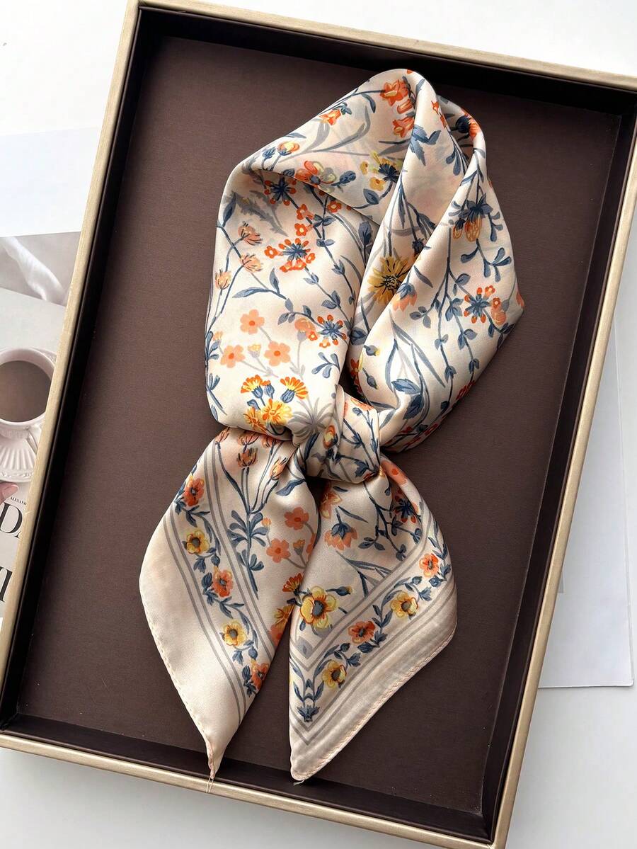 Elevate your spring and summer wardrobe with this elegant silk scarf featuring a vibrant flower print. Crafted from luxurious silk, it drapes beautifully around your neck, shoulders, or hair, adding an instant touch of sophistication to any outfit. The timeless floral design complements casual and dressy looks alike, making it a versatile accessory for every occasion. Lightweight and breathable, it's perfect for warm weather styling while providing gentle UV protection. 